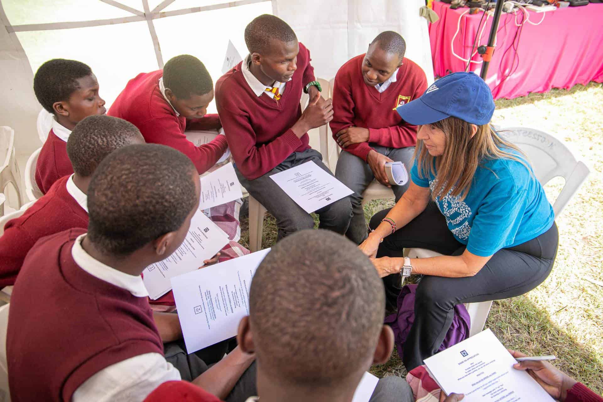 Ellyn with high school students facilitating Safe Conversations